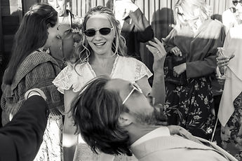Charlotte laughing as she dances, in black and white