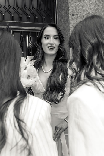Albina surrounded by loved ones, in black and white