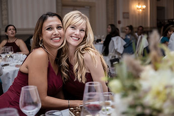 Two guests posing at the table
