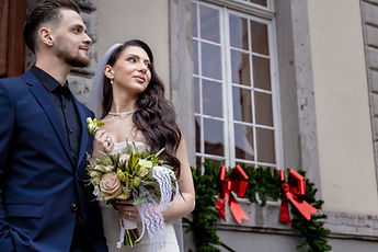 Portrait of the newlyweds, bouquet in the foreground