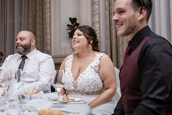 Sabrina and Idrisse laughing during a speech