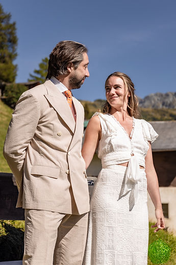 Charlotte and Derek looking at each other during the ceremony