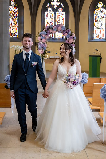 The couple leave the choir hand in hand