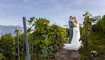 The couple at the end of a row of vines
