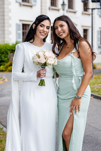 The bride and a friend, smiling portrait