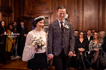 Ly and Antoine standing in front of their guests