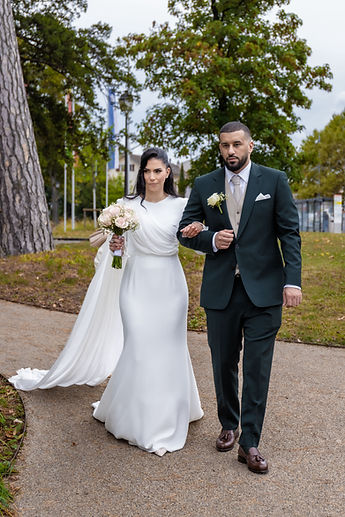 Leila and Marouan walk on, arm in arm