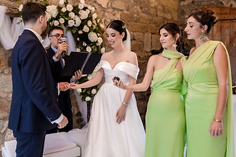 The exchange of rings, with their friends beside them
