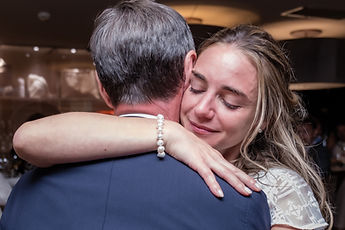Charlotte closing her eyes in a loved one's arms