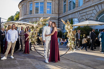 A keepsake photo under the flower arch