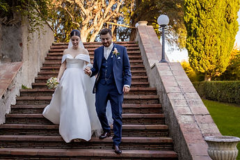Gemma and Jean walk down the stairs, hand in hand