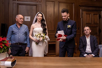 Mersim holding the red booklet