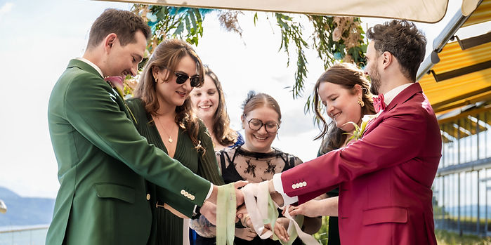 Laughter during the ribbon ritual, Loïc and Boris's ceremony at Le Mirador, Mont-Pèlerin