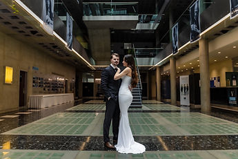 Wide view of the hotel lobby, the couple in the centre