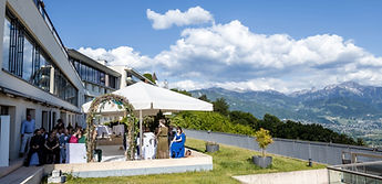 Overview of the ceremony on the terrace, the mountains in the distance