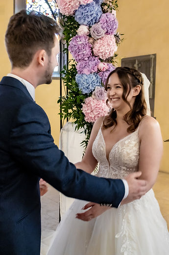 Lucie laughs as Patrick holds her by the waist