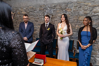 The civil ceremony in the stone-walled room