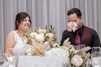 Idrisse wiping away a tear, Sabrina smiling