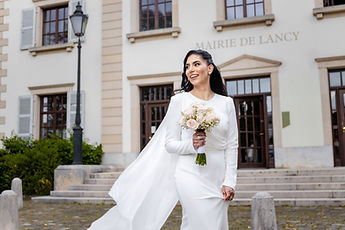 Leila smiles in front of the town hall façade