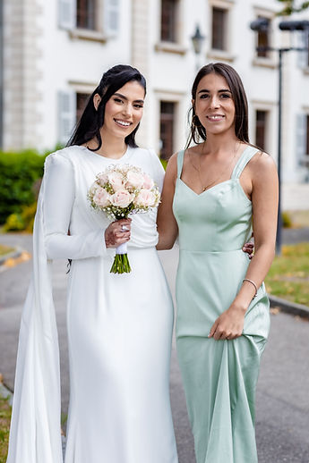 Leila and a friend in a soft-green satin dress