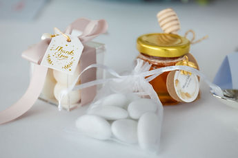 Detail: sugared almonds and a small jar of honey for the guests