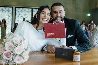 Leila and Marouan pose with their red booklet