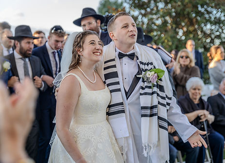 newly wed bride and groom candid photo during their wedding