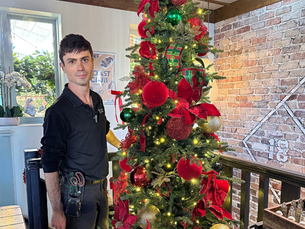 Sydney Christmas tree hire for a corporate Christmas in July event, professionally styled by Jake Decorates with traditional red, green and gold Christmas decorations.