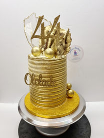 Gold cake with gold decorations
