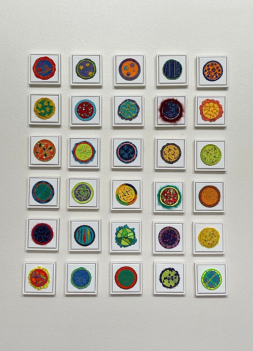 Colorful textile art displayed together to make a unique art.