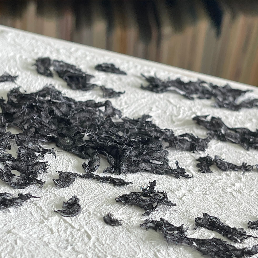 Thumbnail: Dark shapes of fabric on a white textured surface, mixed media art