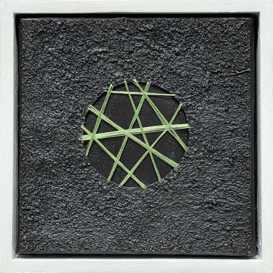 Abstract art: lime green lines intersect within a circular cutout on a dark gray textured background