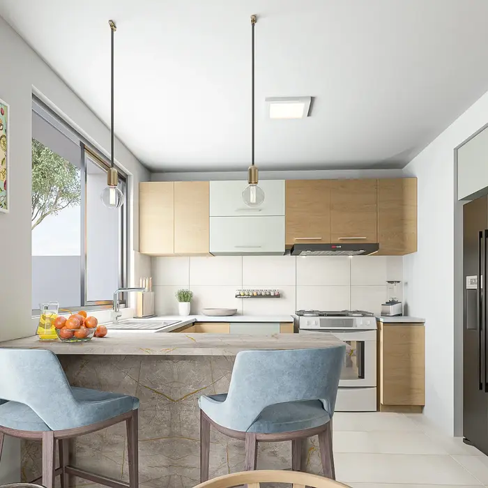 Cocina del proyecto Anayansi con isla central, electrodomésticos integrados, iluminación natural y diseño funcional pensado para la vida diaria.