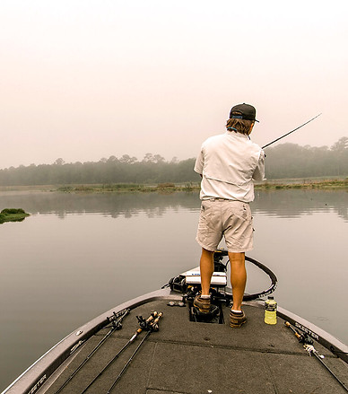 Man fishing on lake at Live Oak Plantation