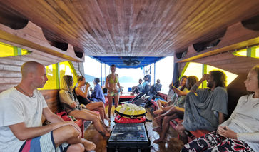 A group of freedivers prepare for an excursion in a boat