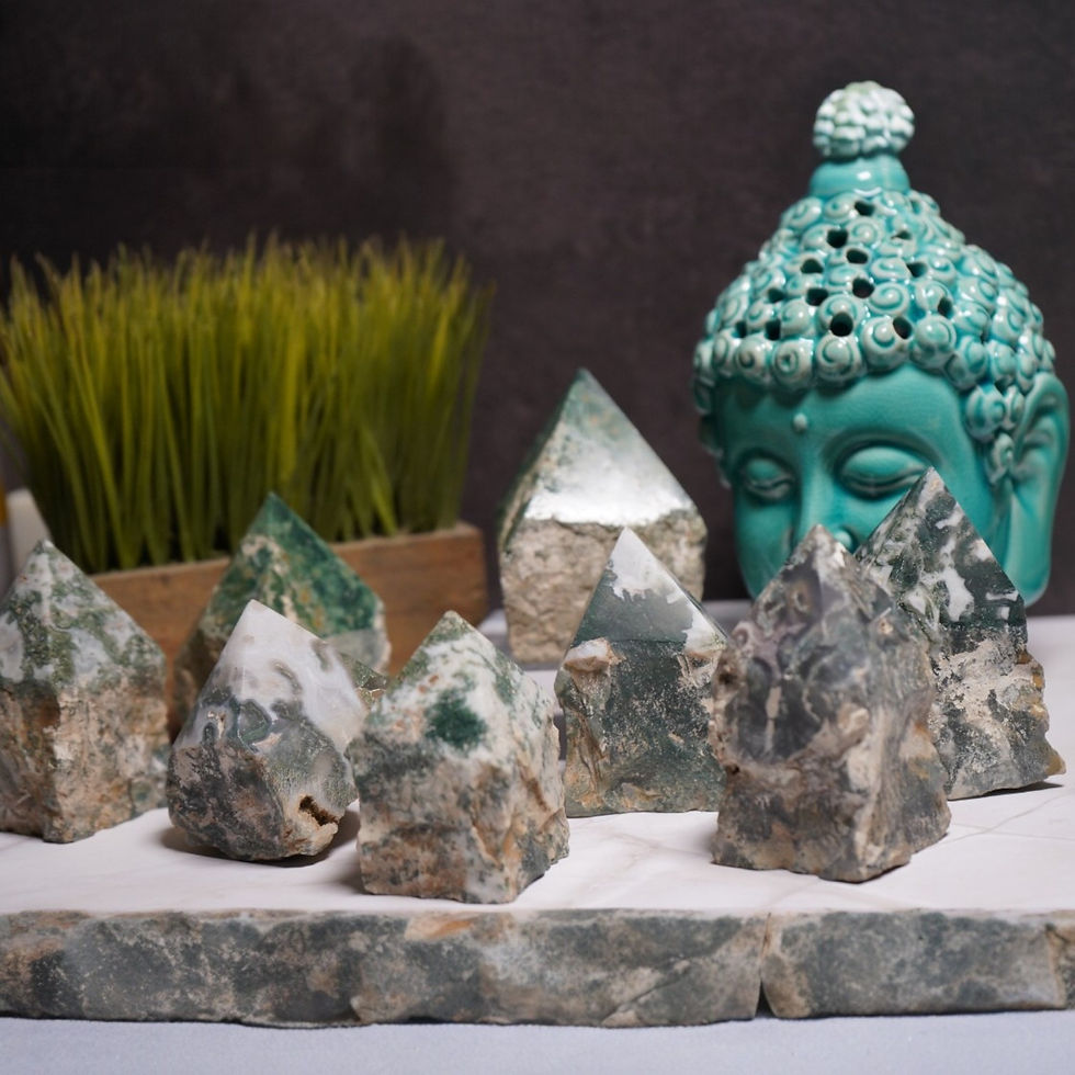 Natural Moss Agate Top Polish Points Next to Buddha Head