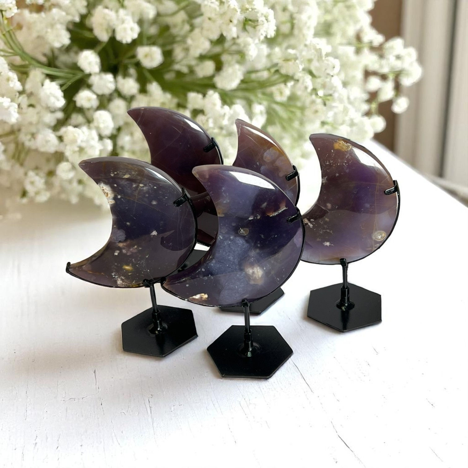 Purple Chalcedony Moons on Stands.