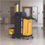 Thumbnail: Black janitorial cart with a yellow waste bag, sturdy design with multiple compartments for cleaning supplies.