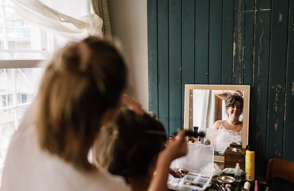 Professional bridal hair dresser and makeup artist working on a wedding at ‘The Artist’s Residence’ in Bristol.