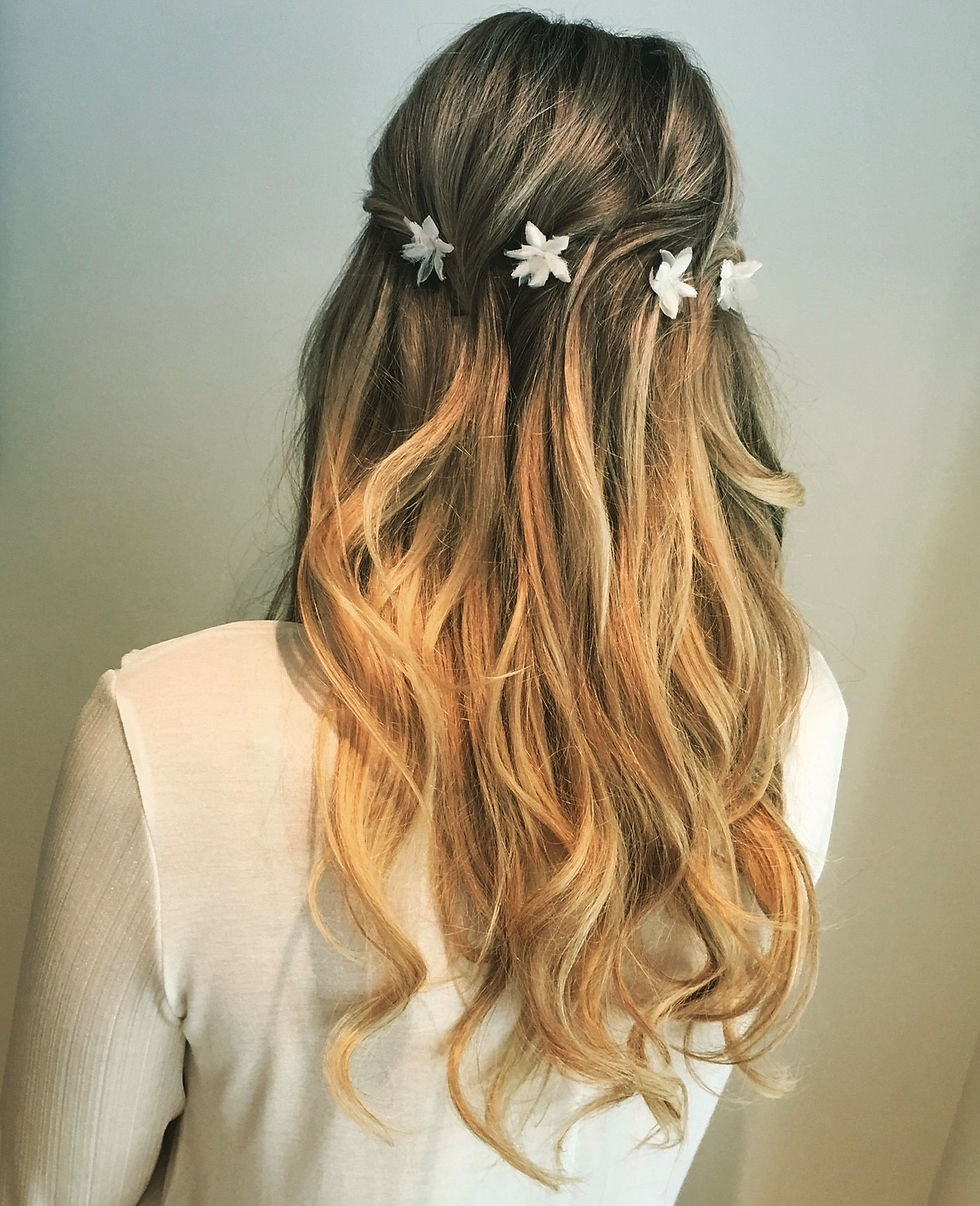 Long wedding hair with flower accessory