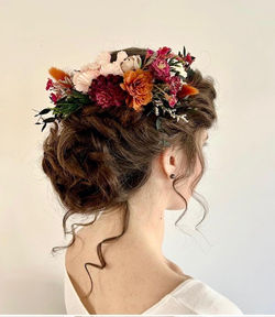 Curled Bridal up do with flowers and tendrils