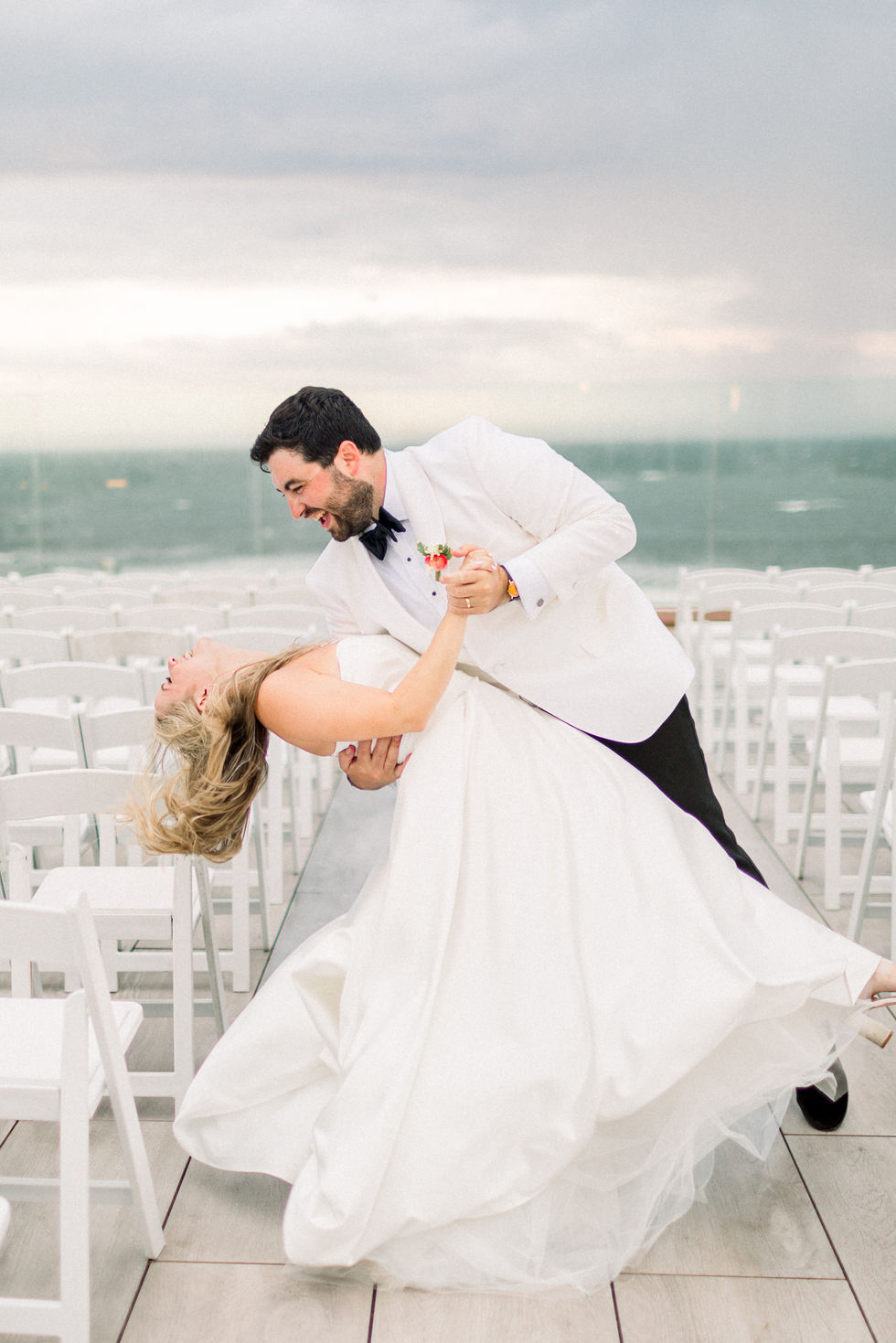 Couple dancing at an outdoor wedding ceremony.