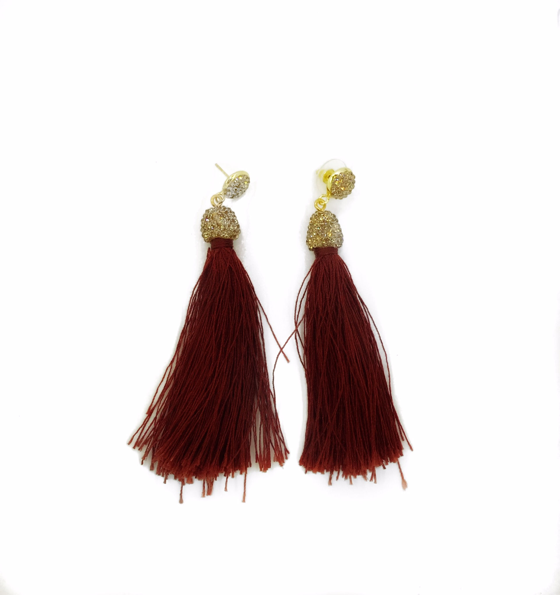 Long gold encrusted merlot tassel earrings