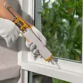 construction-worker-using-silicone-sealant-600nw-2480425877.webp