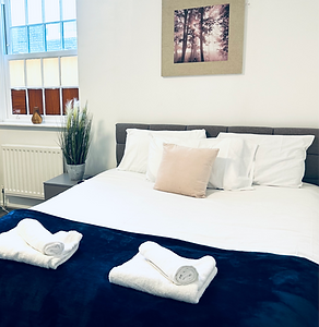 bed with blanket and pillows