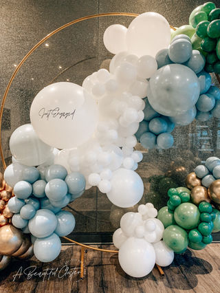 Engagement party balloon decor garland.
