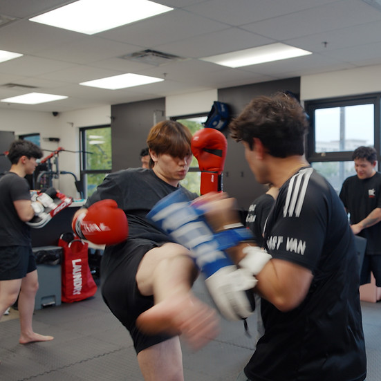 Beginner Muay Thai class learning fundamentals at DK Boxing in Richmond BC