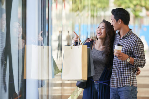 carefree-couple-window-shopping-clothes-store.jpg