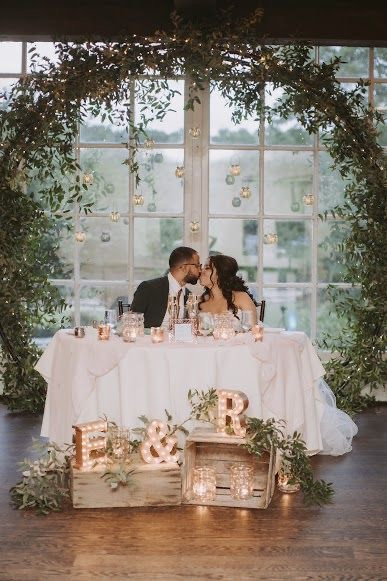 GREENERY COVERED WEDDING RING ARCH
