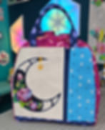 The Rose Moon as a pocket panel in the Courtside bag